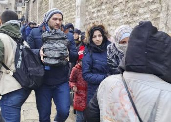 Syria, Aleppo, Aleppo Governorate, 6 February 2023 In the photo: Abdullah Al Shaghel, Field Monitor Assistant, distributing emergency food purchased by WFP to displaced people in Aleppo.